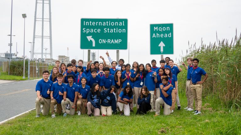 VSCS attendees pose at the Antares launchpad.